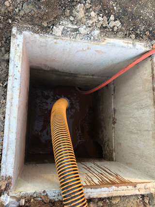 cleaning a drain with vacuum excavation